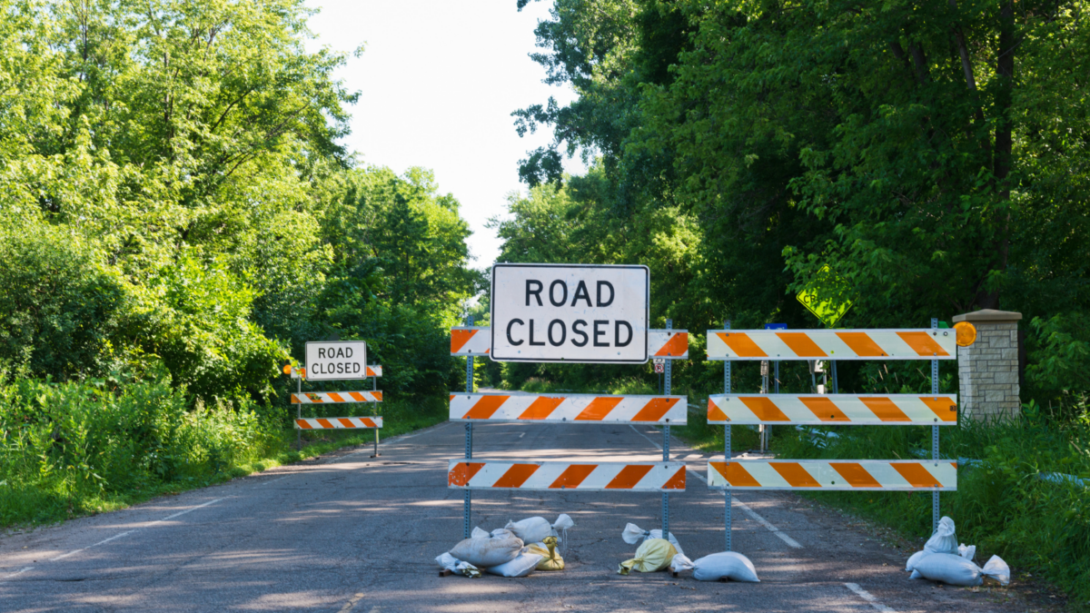 Photo of a road barrier that says 