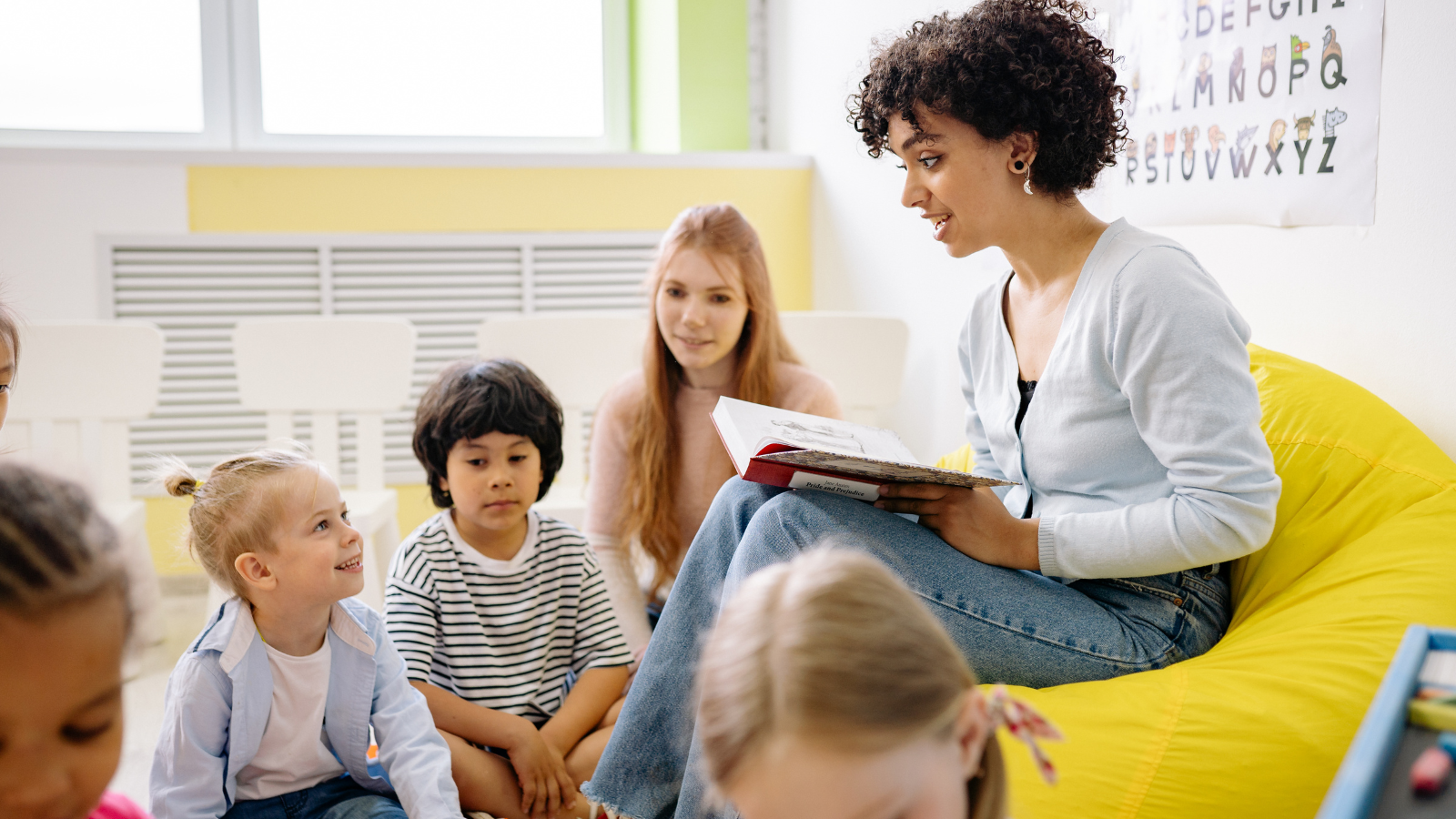 Teacher reading to students in elementary school