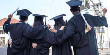 Picture of grads in gowns and caps from the back
