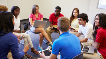 High school students discussing a serious topic while sitting in a circle